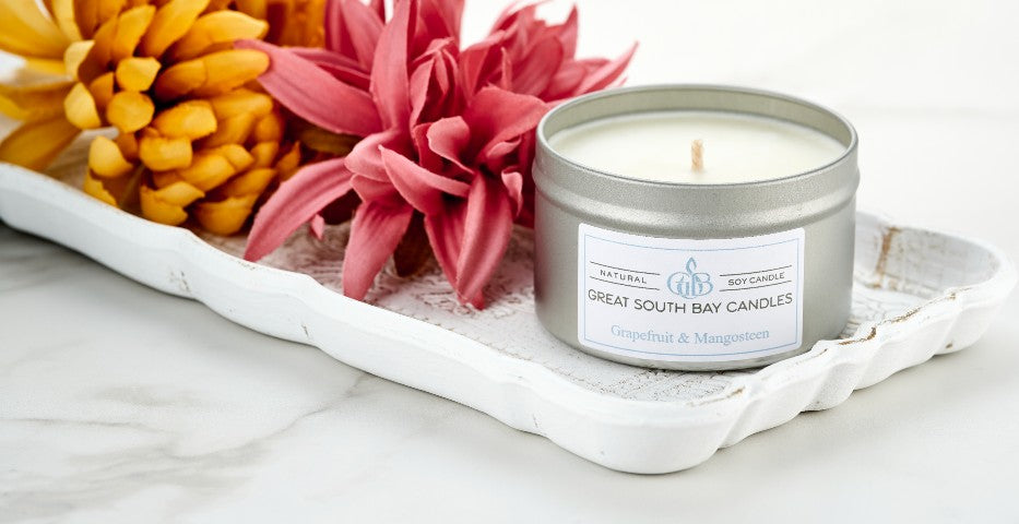 Grapefruit & Mangosteen scented soy candle in silver travel tin 