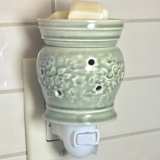 Green jasmine floral pluggable wax warmer.