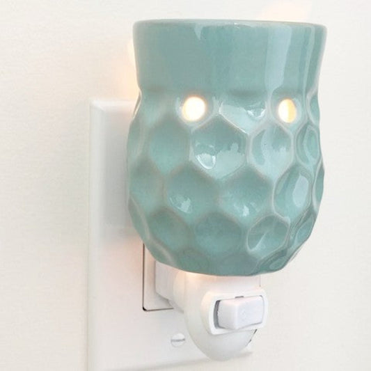 Honeycomb plug in candle wax warmer in turquoise.