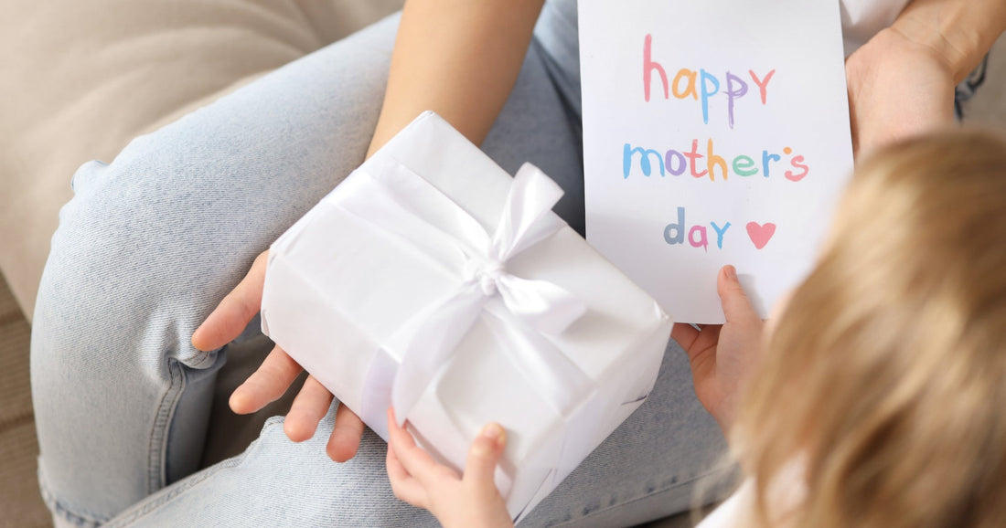 Happy Mothers Day gift giving between child and Mom.