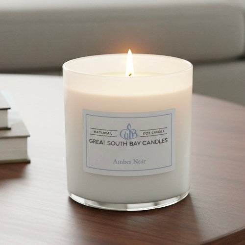Amber Noir Candle on a living room table