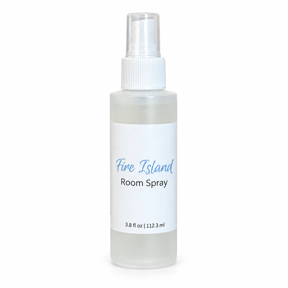 A frosted plastic room spray bottle with a white spray cap and a white label reading 'Fire Island Room Spray' in blue and black text, set against a plain white background.