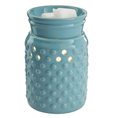 Turquoise Hobnail style candle wax warmer on a white background.