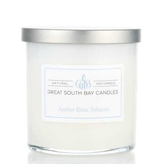 Great South Bay Candles Amber Rose Tobacco candle with silver lid on a white background.