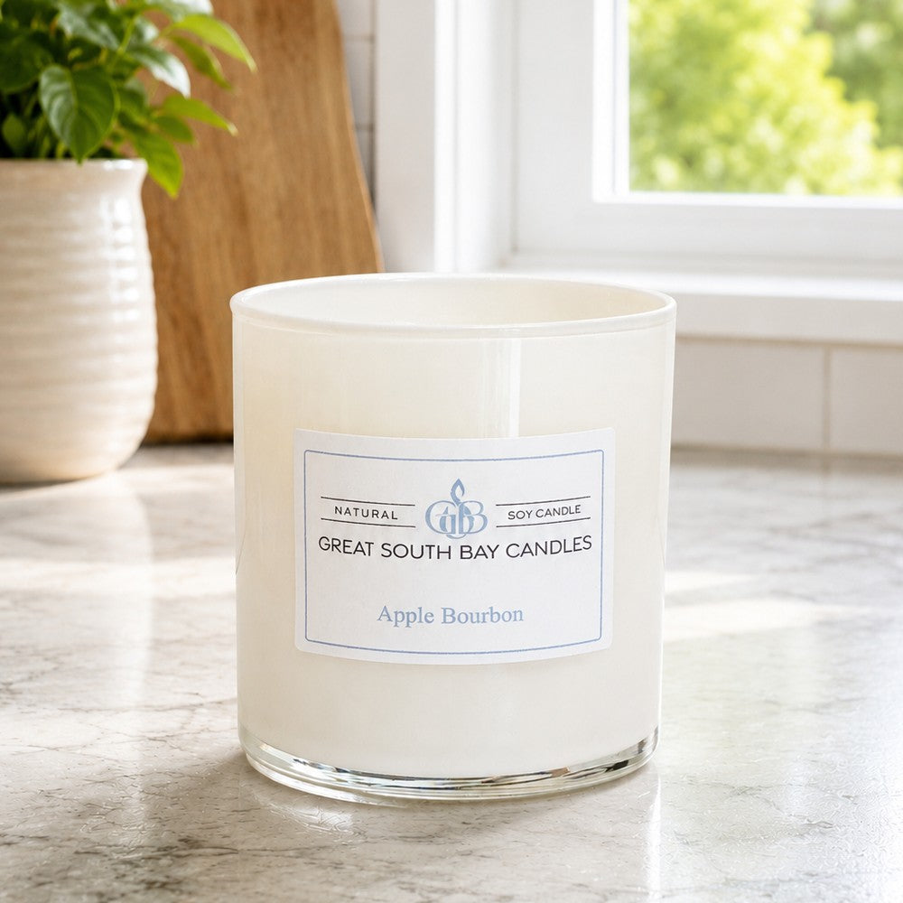 Apple Bourbon scented candle in a 8oz white glass tumbler.