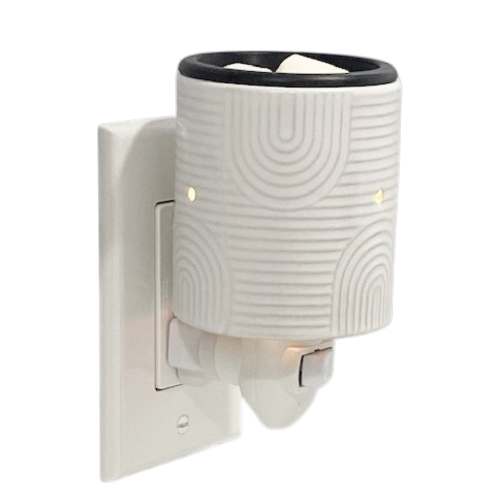 White plug in candle warmer on a white background.