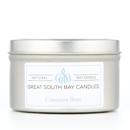 Cinnamon Bun scented candle in a silver travel tin on a white background.