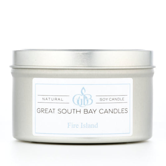 Fire Island beach scented candle in a travel tin on a white background.