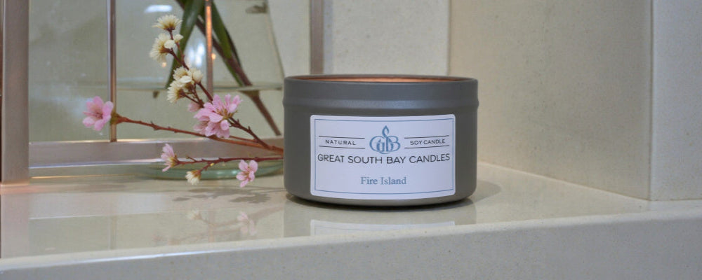 fire island beach scented candle in a silver in with a lid