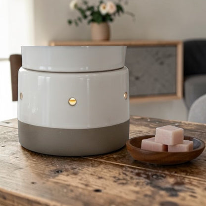 Grey concrete tabletop wax warmer on a table. 