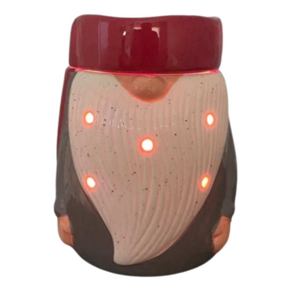 Gnome electric tabletop candle wax warmer on a shelf.