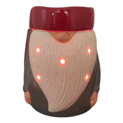 Gnome electric tabletop candle wax warmer on a shelf.