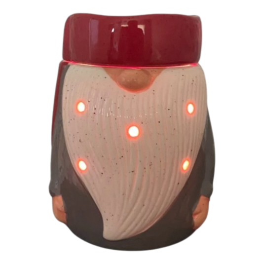 Gnome electric tabletop candle wax warmer on a shelf.