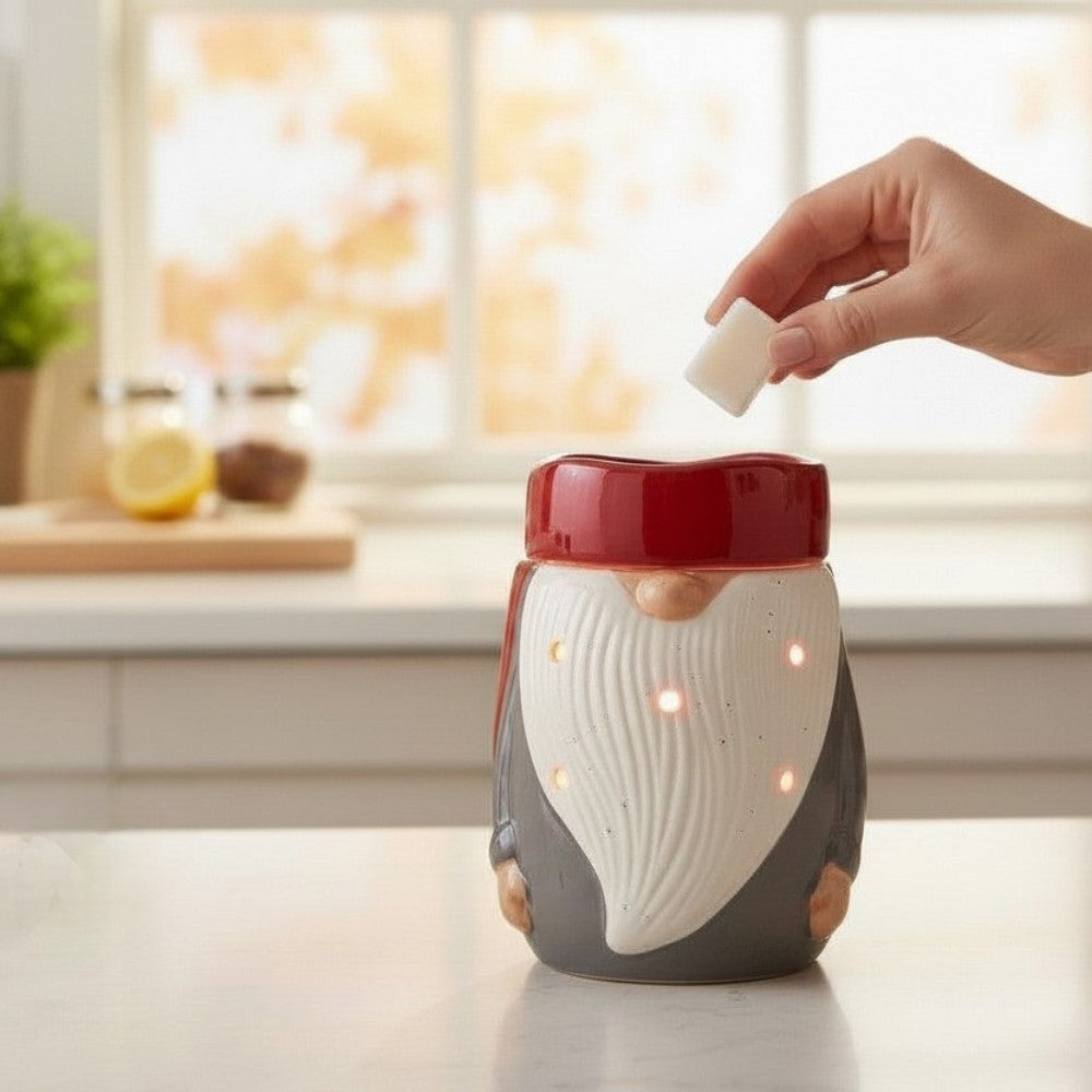 Gnome candle wax warmer on a counter against a kitchen background.