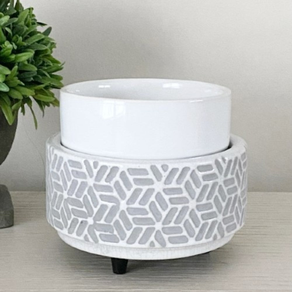 Tabletop candle warmer in a grey and white hexagon pattern on a light surface.