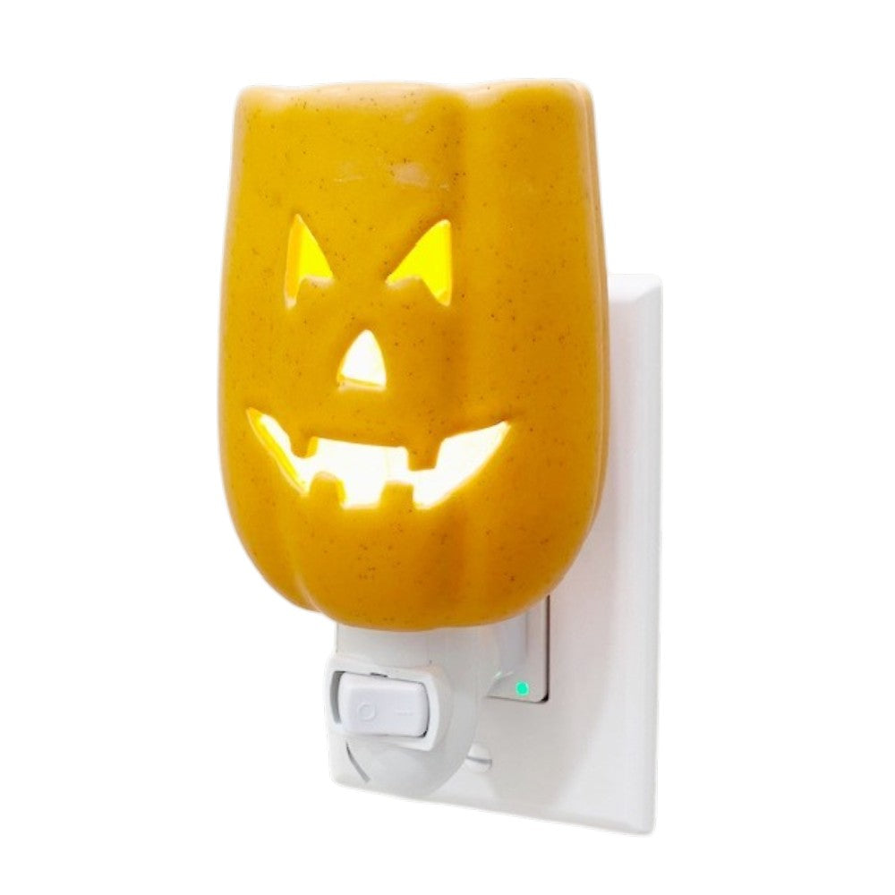 Halloween Jack O Lantern wall plug in candle wax warmer on a white background.