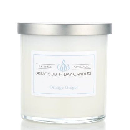 Orange Ginger scented candle in a glass tumbler.