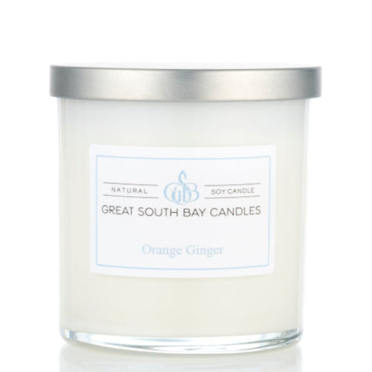 Orange Ginger scented candle in a glass tumbler.