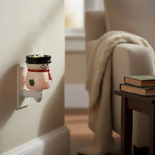 Snowman plug in candle wax warmer in a living room. 