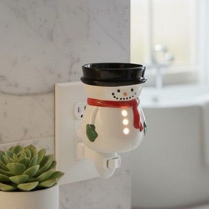 Snowman wax warmer in a bathroom. 