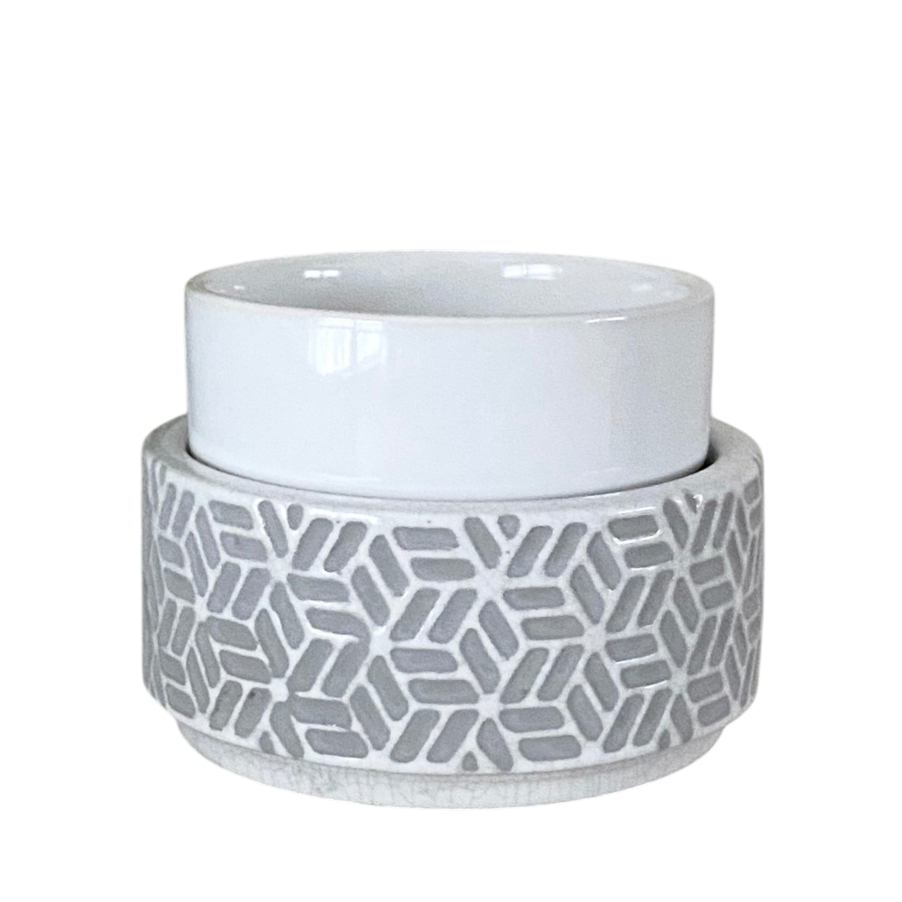 Ceramic container with geometric pattern on a white background