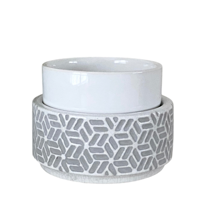 Ceramic container with geometric pattern on a white background