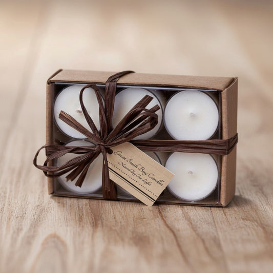 Set of 12 unscented tealights in a brown box with brown ribbon.