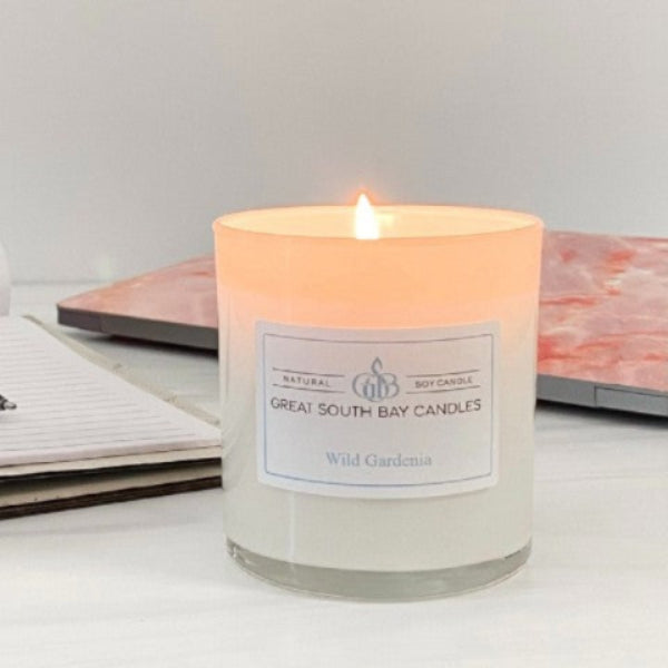 wild gardenia candle in a white glass container