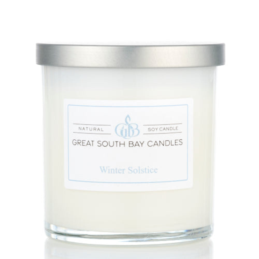 Winter Solstice winter scented candle in a white glass tumbler.