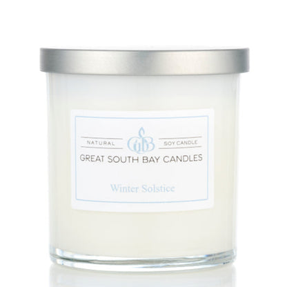 Winter Solstice winter scented candle in a white glass tumbler.