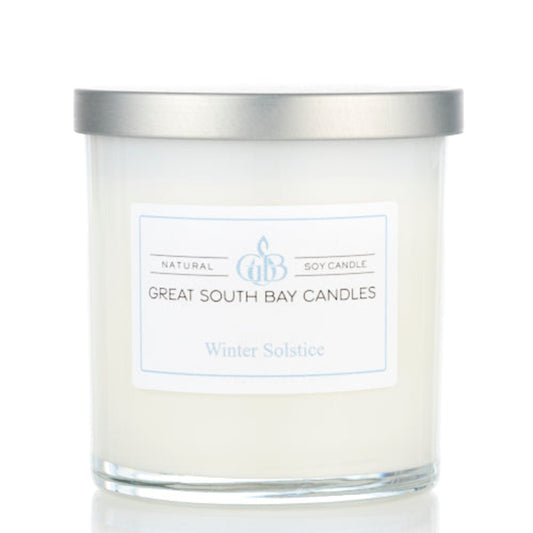 Winter Solstice winter scented candle in a white glass tumbler.