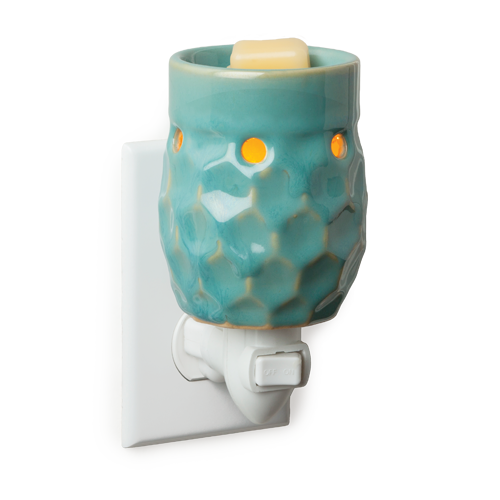 Blue honeycomb plug in outlet candle wax warmer.